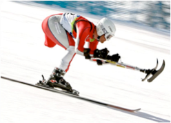 Photograph of Paralympic ski racer with adaptive poles.